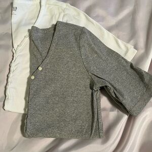 2 short sleeve Henley tops. Gray and white. 3/4 button with V neck. Never worn!